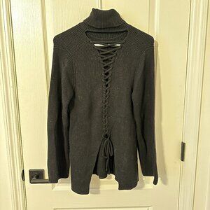 Black turtleneck tie-back sweater